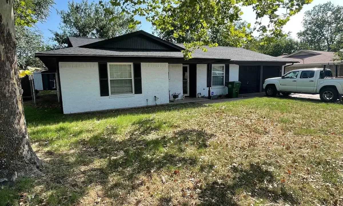 Professional roofing crew working on a residential roof in Evergreen Park
